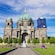 The entrance of the Berlin Cathedral with domed rooftops and ornately carved stone, overlooking a grassy lawn and fountain